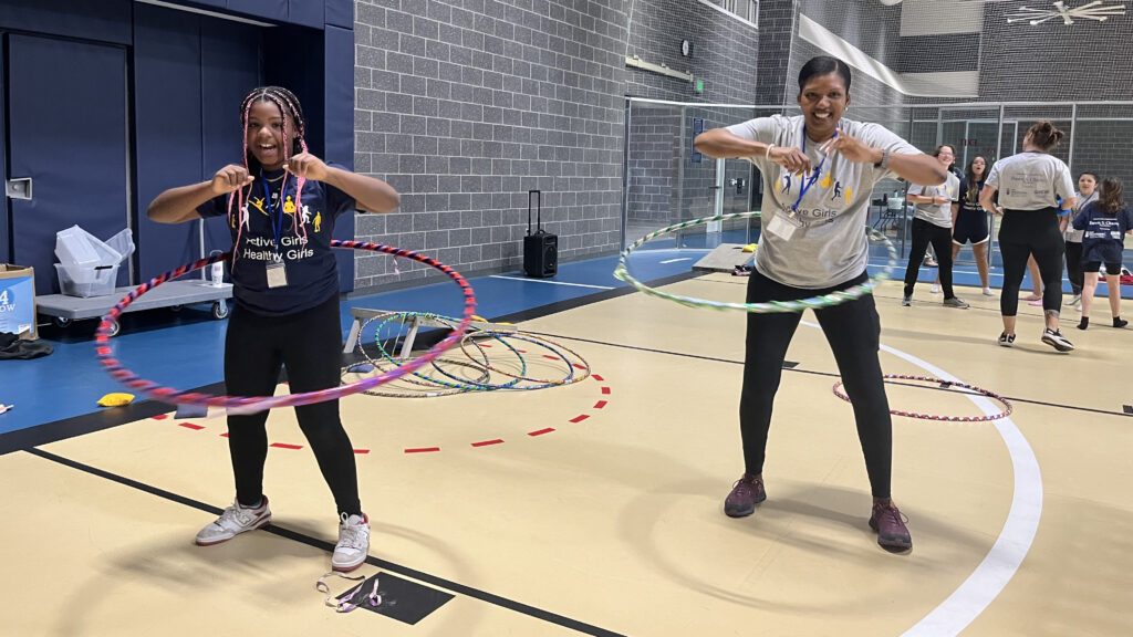 girl and woman with hoola hoops
