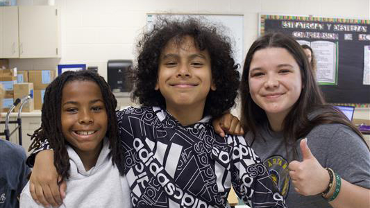 Bethany  Allen Poses with fifth graders at Jones Elementary