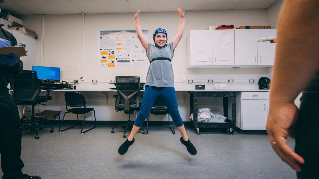 Child exercising in a lab.