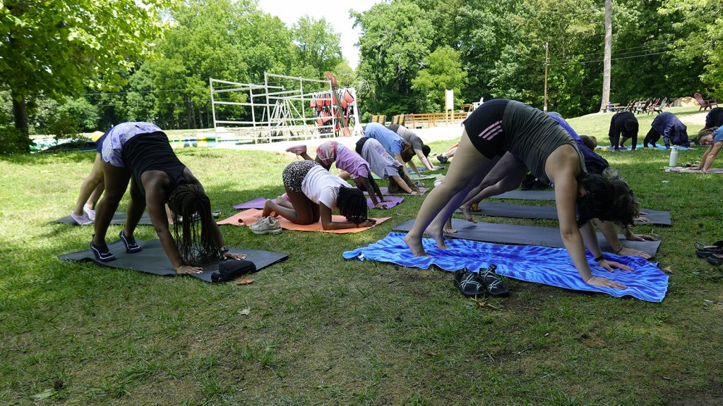 Campers at Camp SpeakaLot doing yoga